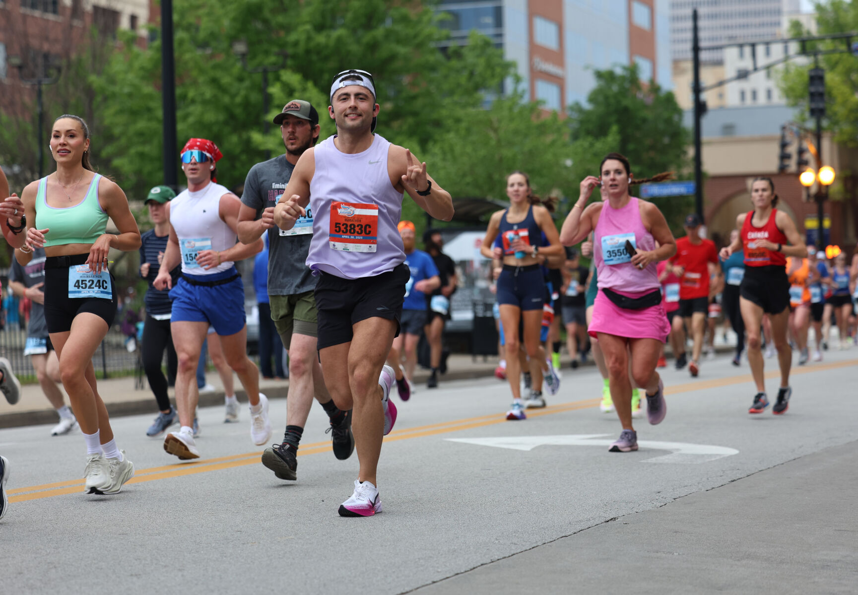 Runners go down 4th street in Louisville.JPG